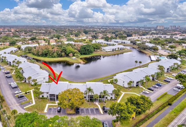 birds eye view of property with a water view