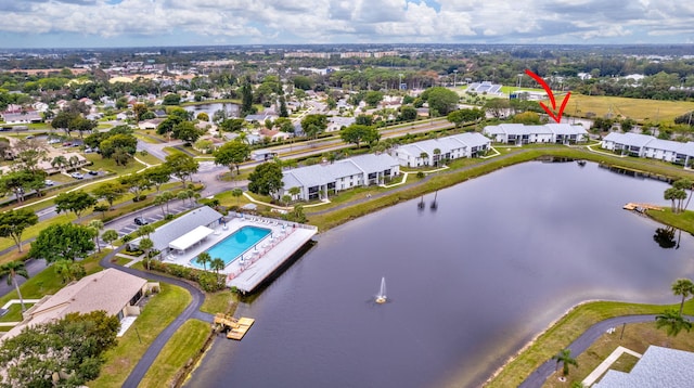 drone / aerial view with a water view