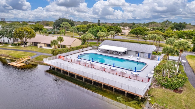 birds eye view of property with a water view