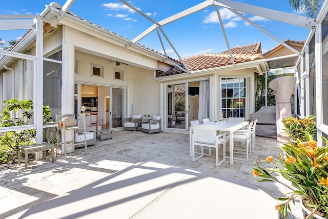 view of patio / terrace featuring glass enclosure