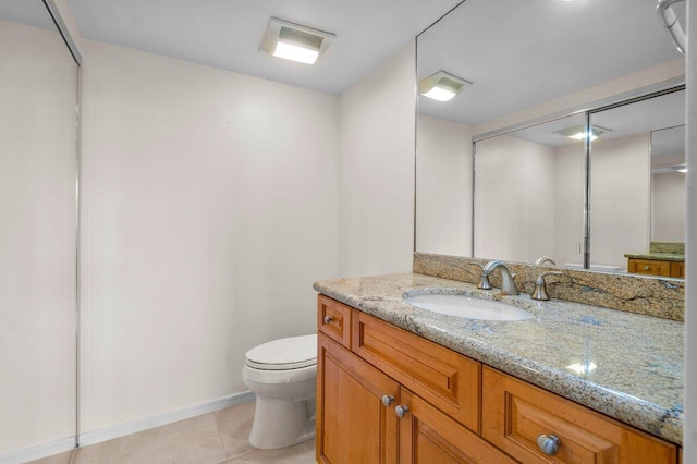 bathroom featuring toilet and vanity