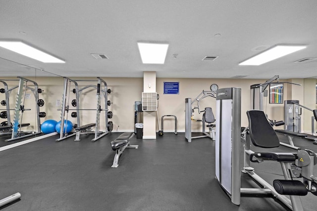 workout area with a textured ceiling