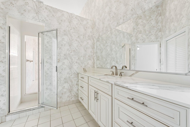 bathroom with vanity, tile patterned flooring, and a shower with shower door