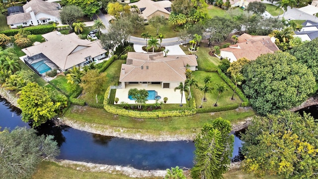 birds eye view of property with a water view