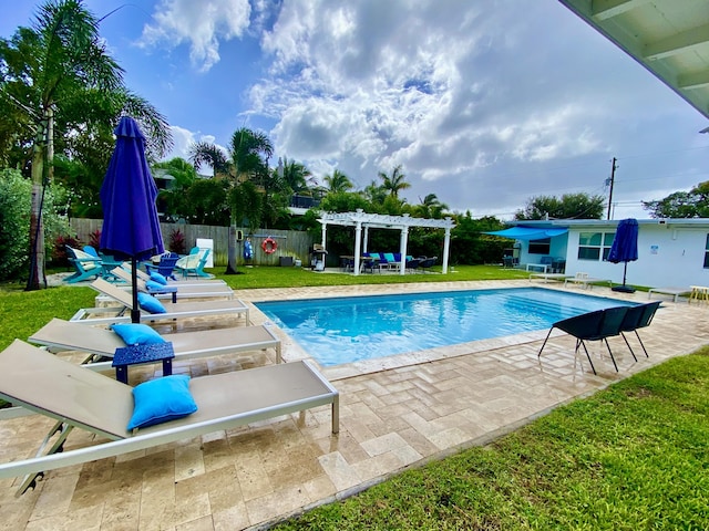 view of swimming pool with a pergola, a patio area, and a lawn