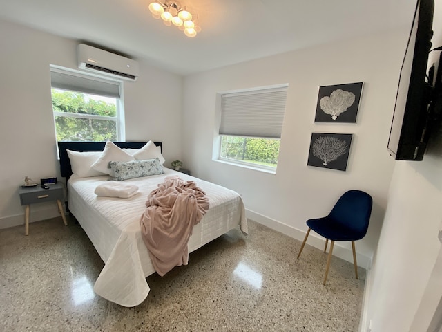 bedroom with multiple windows and a wall mounted air conditioner