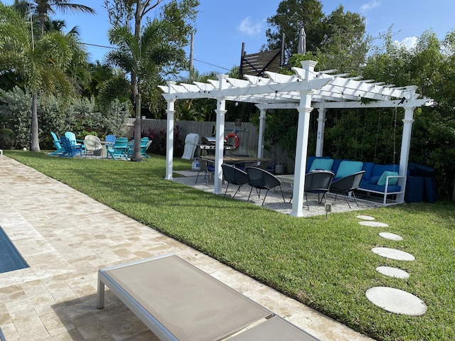 view of yard featuring a patio area, an outdoor living space with a fire pit, and a pergola