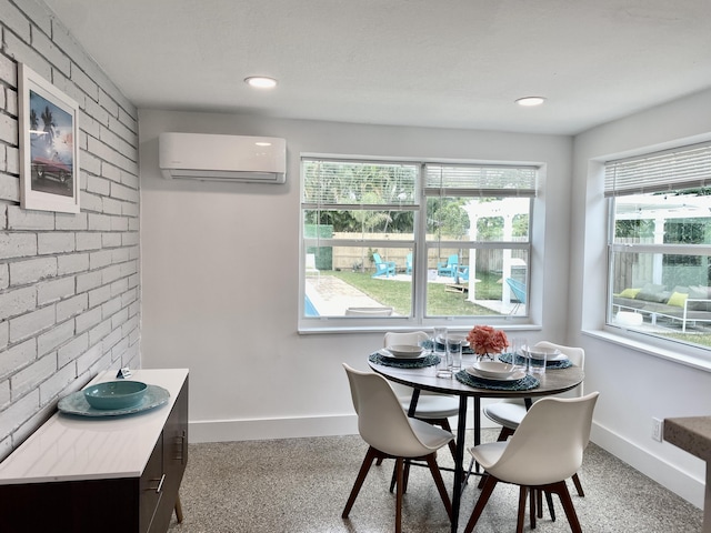 dining area with a wall mounted AC