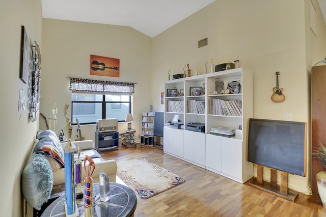 interior space featuring light hardwood / wood-style flooring and vaulted ceiling