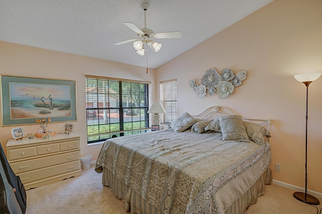 bedroom featuring light carpet, ceiling fan, lofted ceiling, and multiple windows