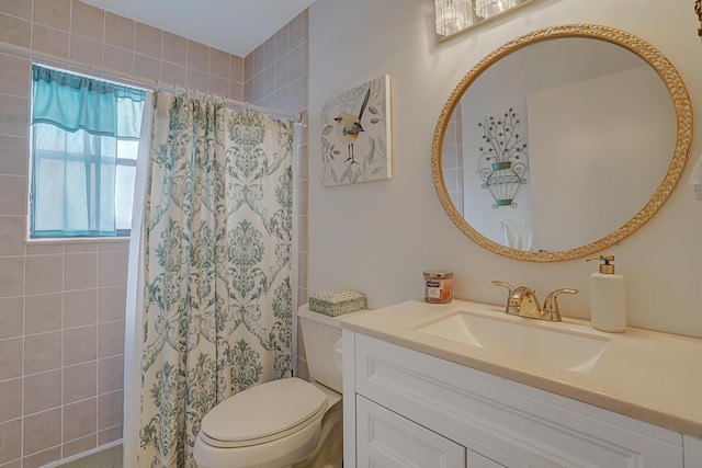 bathroom with toilet, a shower with shower curtain, and vanity