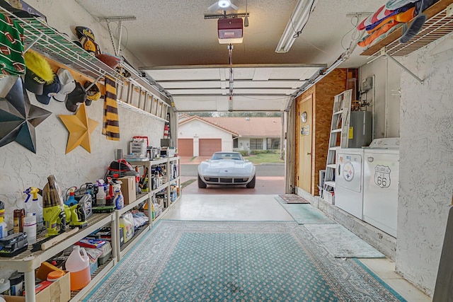 garage featuring a garage door opener, independent washer and dryer, and gas water heater