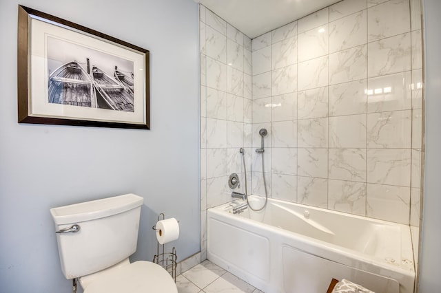 bathroom featuring toilet and tiled shower / bath combo