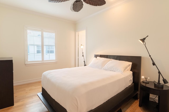 bedroom featuring light hardwood / wood-style flooring and ornamental molding