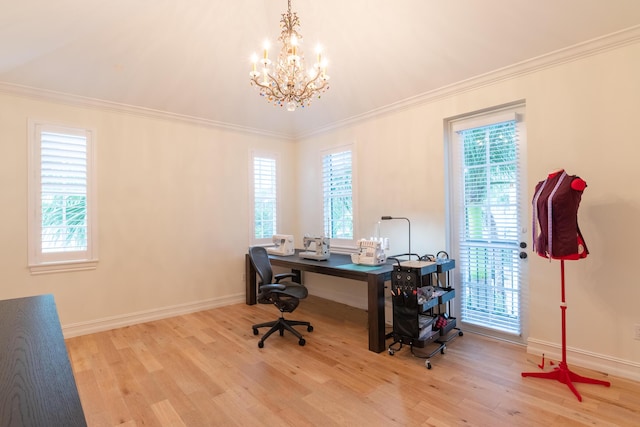 office area with ornamental molding, light hardwood / wood-style floors, and a healthy amount of sunlight