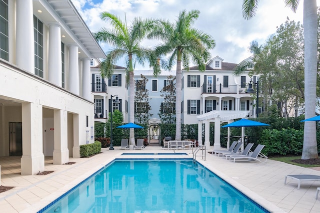 view of pool with a pergola and a patio area