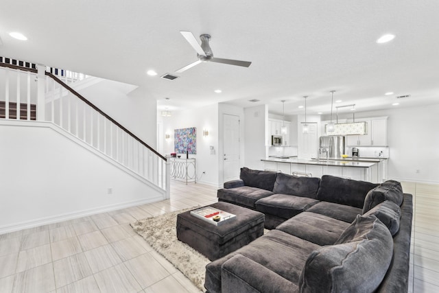 living room with ceiling fan