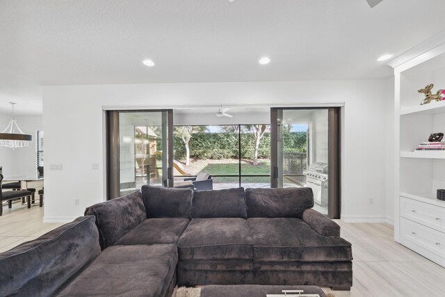 kitchen with decorative light fixtures, a breakfast bar area, stainless steel appliances, and white cabinetry