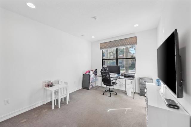 office area featuring light carpet