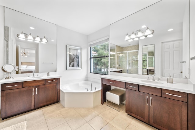 bathroom featuring tile patterned floors, vanity, and independent shower and bath