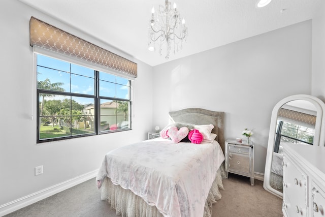 bedroom with light colored carpet and an inviting chandelier