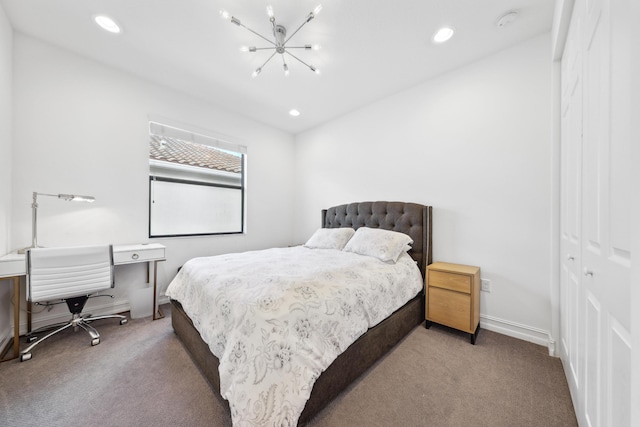 carpeted bedroom with an inviting chandelier and a closet