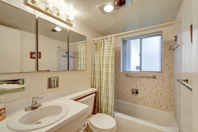 full bathroom featuring toilet, vanity, and shower / tub combo with curtain