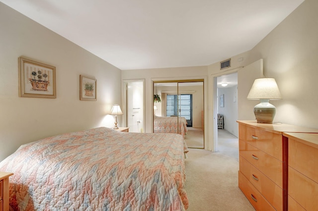 carpeted bedroom featuring a closet