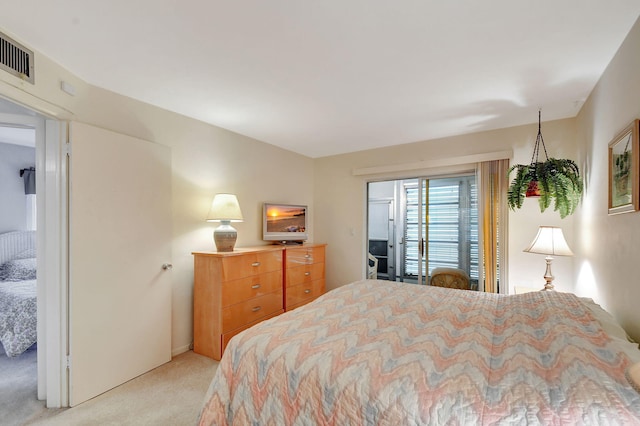 bedroom with light colored carpet