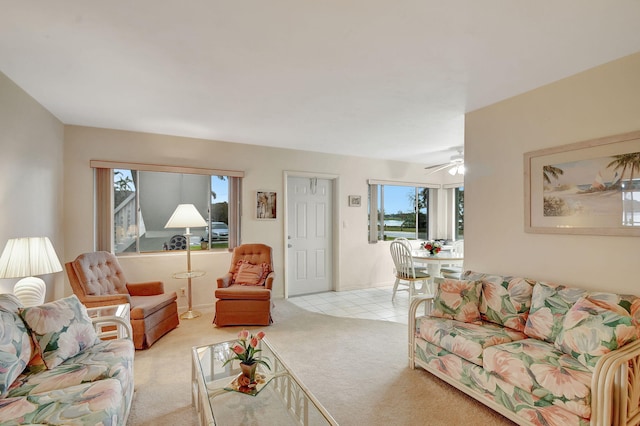 living room with light carpet and ceiling fan