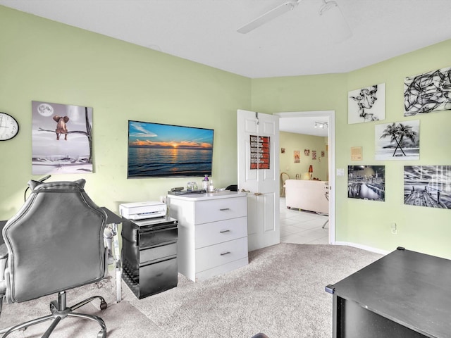 carpeted home office with ceiling fan