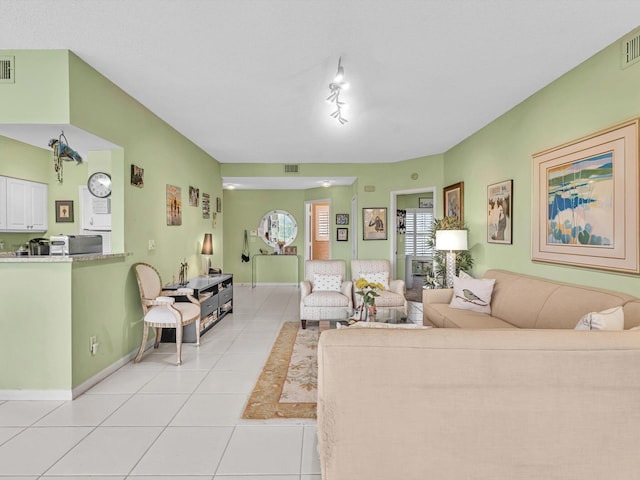 living room with light tile patterned floors