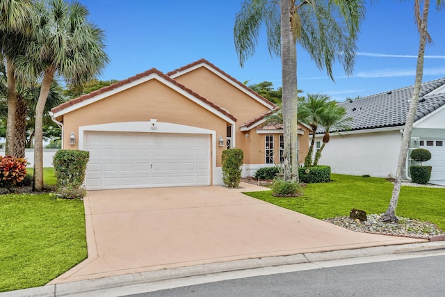 view of front facade featuring a garage and a front lawn