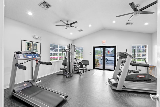 gym with ceiling fan, a textured ceiling, and vaulted ceiling