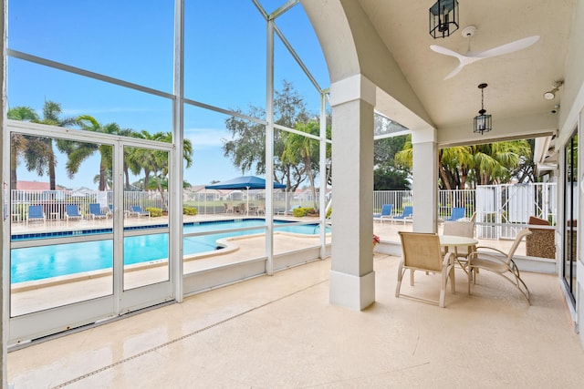 view of pool featuring ceiling fan and a patio area