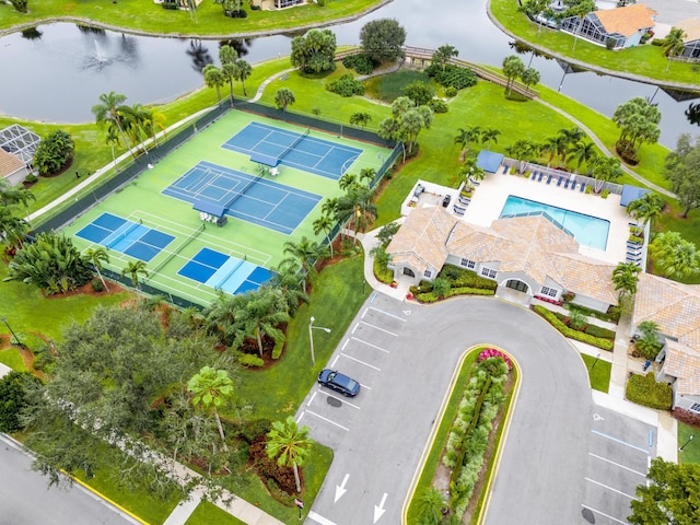 birds eye view of property with a water view