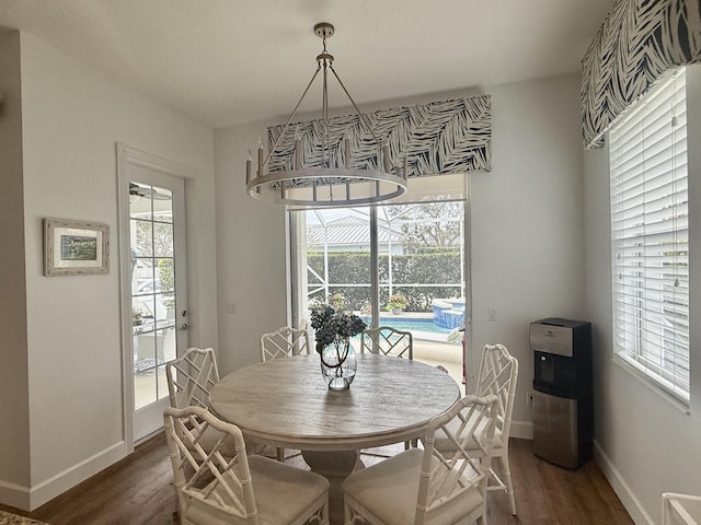 3289 Wymberly Dr, Jupiter, FL 33458 - dining space featuring dark wood-style flooring and healthy amount of natural light