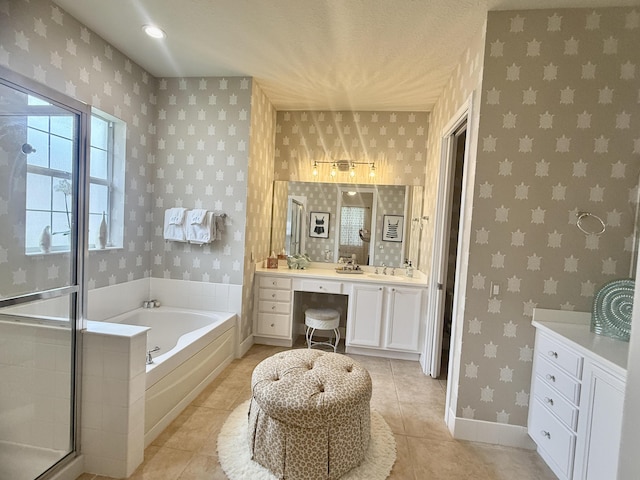 3289 Wymberly Dr, Jupiter, FL 33458 - full bathroom with wallpapered walls, vanity, a bath, tile patterned flooring, and a stall shower