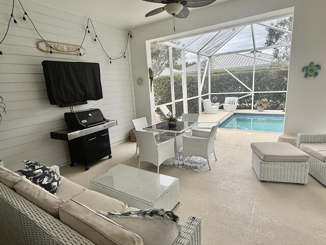 view of pool featuring glass enclosure, a patio area, and an in ground hot tub