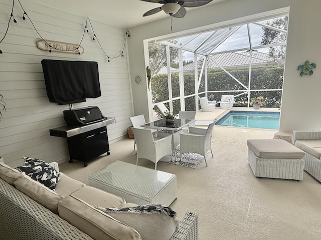 3289 Wymberly Dr, Jupiter, FL 33458 - living room with a sunroom, ceiling fan, and wood walls