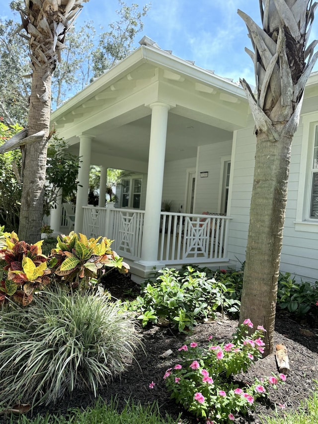 3289 Wymberly Dr, Jupiter, FL 33458 - view of property exterior with covered porch