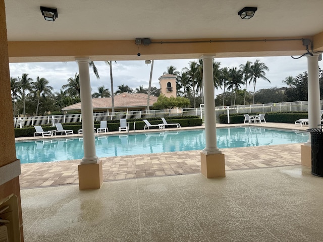 3289 Wymberly Dr, Jupiter, FL 33458 - community pool featuring a patio area and a fenced backyard
