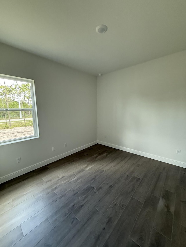 14042 82nd St N, The Acreage, FL 33470 - spare room with dark wood-type flooring and baseboards