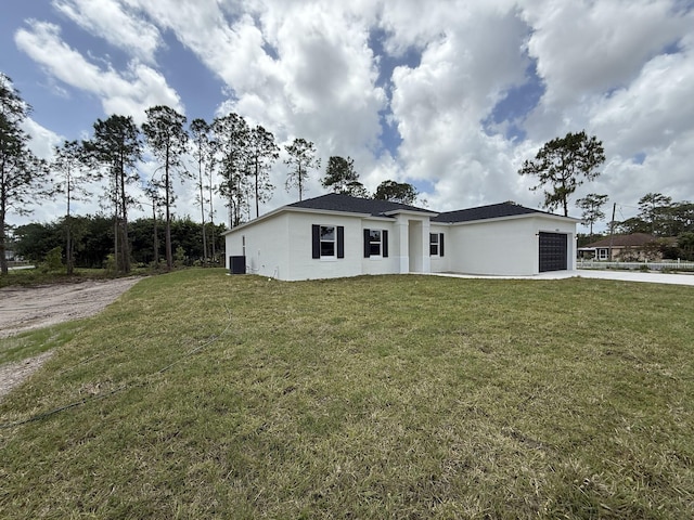 14042 82nd St N, The Acreage, FL 33470 - view of front facade featuring an attached garage, driveway, a front yard, stucco siding, and cooling unit
