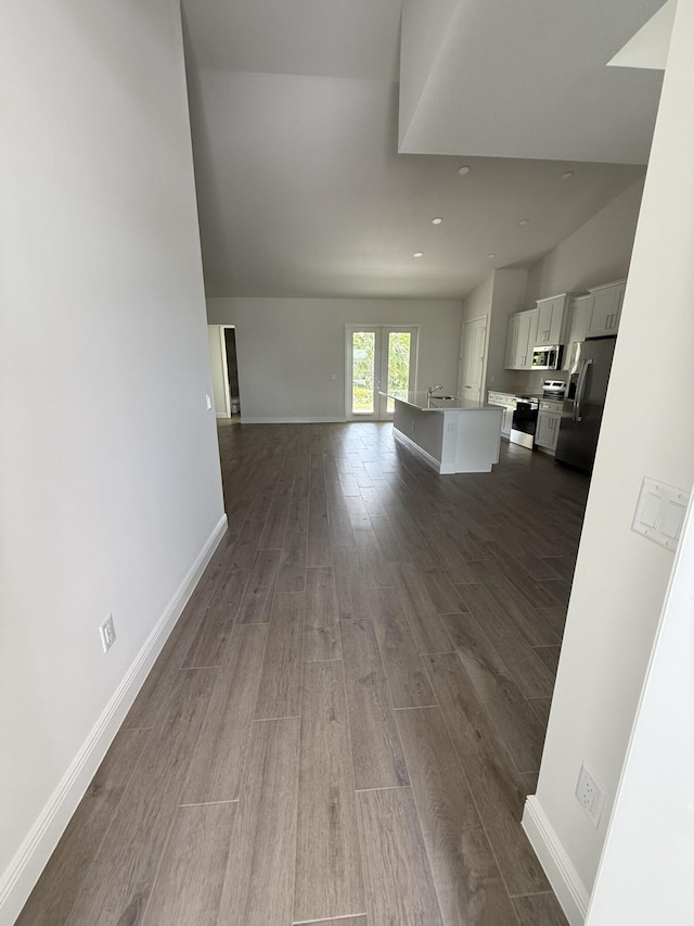 14042 82nd St N, The Acreage, FL 33470 - unfurnished living room with dark wood-style flooring, recessed lighting, and baseboards
