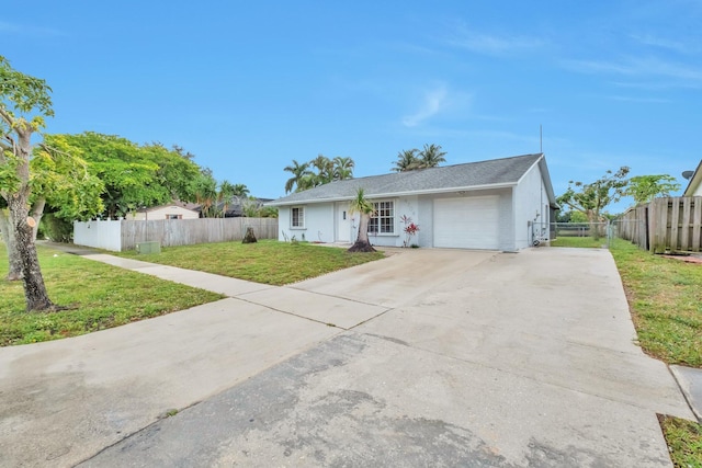 ranch-style home with a front lawn and a garage