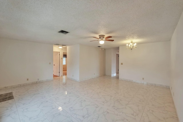 unfurnished room featuring ceiling fan with notable chandelier and a textured ceiling