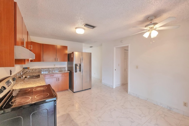 kitchen featuring ceiling fan, sink, a textured ceiling, and appliances with stainless steel finishes