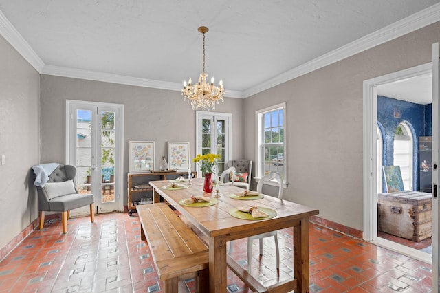 dining space featuring an inviting chandelier and ornamental molding