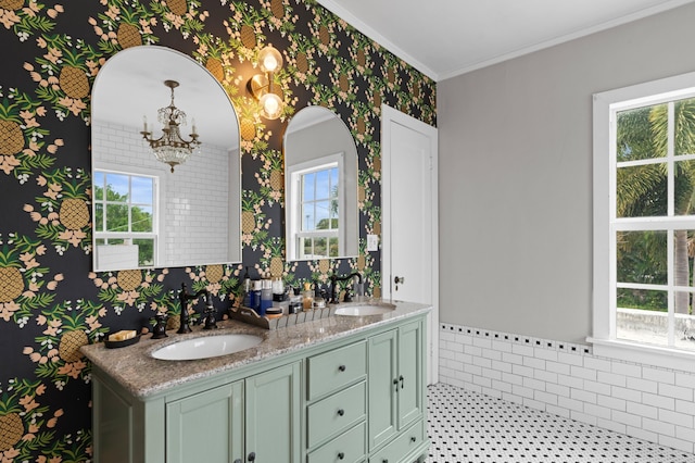 bathroom with plenty of natural light, vanity, and ornamental molding